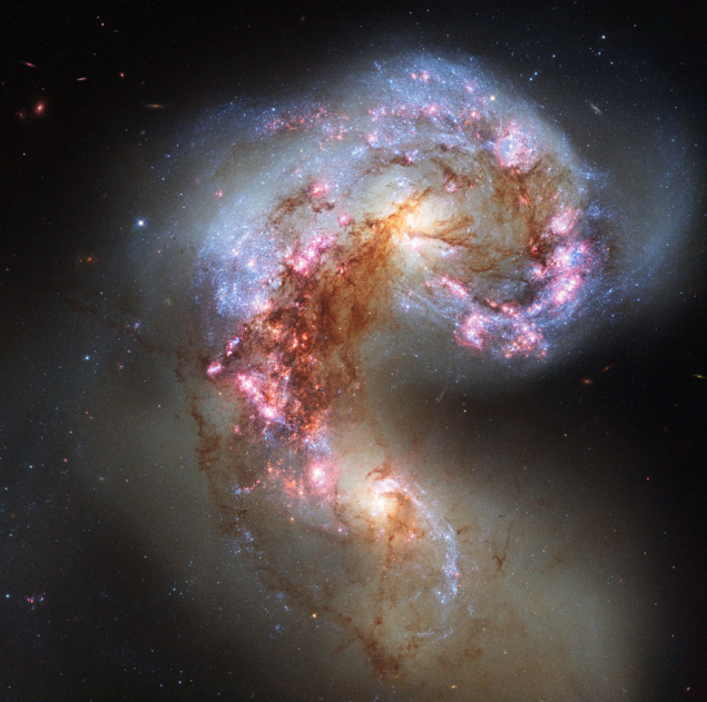 Image of two gigantic galaxies colliding and tearing each other apart
